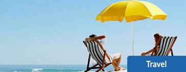 two deck chairs with yellow beach umbrella