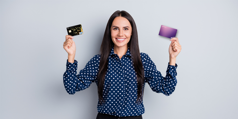 woman holding visa prepaid card and eftpos prepaid card