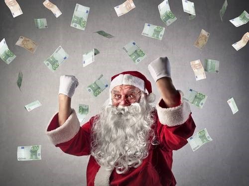 santa with dollar banknotes falling